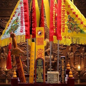 Taoist ritual instruments collection on dark lacquered table
