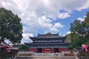 Ancient Taoist temple gate in misty mountains of Longhu Mountain